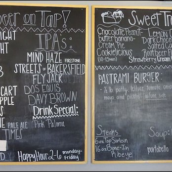 P Dubs Grille & Bar - The "Beer on Tap" menu is posted on the wall next to the entrance to the kitchen. - New American Near Me - Tehachapi, California