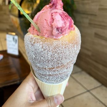 Unique Pastry Factory - a hand holding a cone of ice cream - Gelato Near Me - Temecula, California Unique Pastry Factory - a hand holding a cone of ice cream - Gelato Near Me - Temecula, California