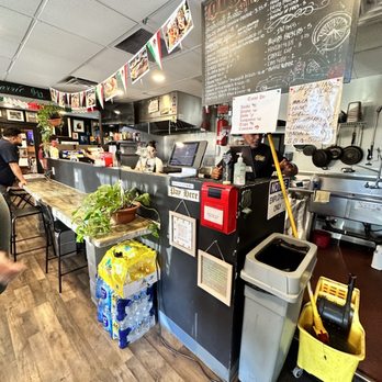 Que Suave Taco Shop - a man preparing food - American Near Me - Phoenix, Arizona