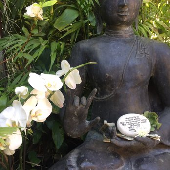 The Sacred Space - Beautiful orchids next to a statue - Art Galleries Near Me - Summerland, California