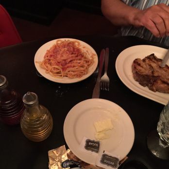 Alice's - a plate of pasta, meat, and butter on a table - Italian Near Me - Iron River, Michigan