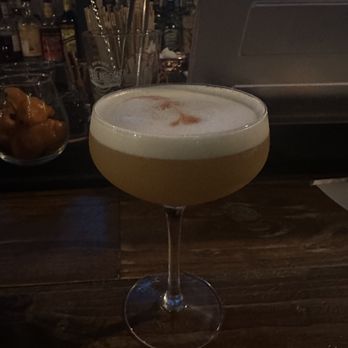 Founders Speakeasy - The Ruby Row: Bourbon, amaretto, giffard rhubarb liquer, fresh orange juice, honey syrup, egg white, served up in a coupe. - Cocktail Bars Near Me - Albuquerque, New Mexico