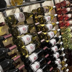 Michigan By The Bottle Tasting Room - Wine wall display