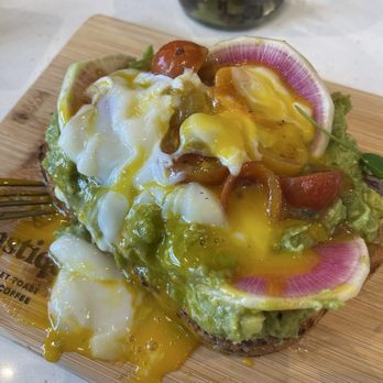 Toastique - Same avocado toast with poached egg, raddish and alfalfa with the poached egg already broken on top. - Juice Bars & Smoothies Near Me - Henderson, Nevada Toastique - Same avocado toast with poached egg, raddish and alfalfa with the poached egg already broken on top. - Juice Bars & Smoothies Near Me - Henderson, Nevada