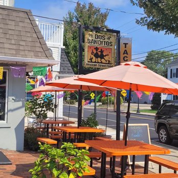 Dos Banditos - the outside of a restaurant with tables and umbrellas - Mexican Near Me - Fair Haven, New Jersey Dos Banditos - the outside of a restaurant with tables and umbrellas - Mexican Near Me - Fair Haven, New Jersey
