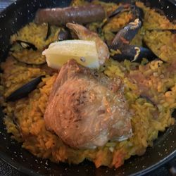 Le France - Paella w chicken thigh, some kind of sausage and mussels.