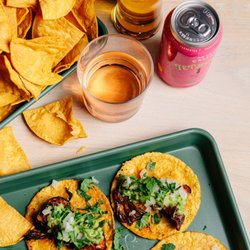 The Green Woodpecker - Plenty of beer, wine, and non-alcoholic options available. (shown: vegan maitake mushroom tacos, house-made corn chips)