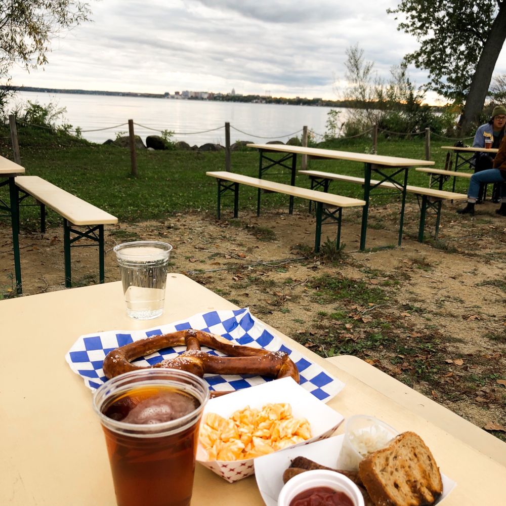 Biergarten at Olbrich Park - a picnic table with food and a glass of beer - Beer Gardens Near Me - Madison, Wisconsin