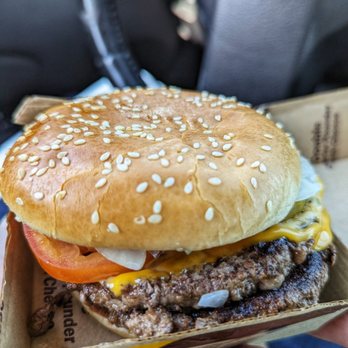 McDonald's - a hand holding a hamburger - Burgers Near Me - Columbia, South Carolina McDonald's - a hand holding a hamburger - Burgers Near Me - Columbia, South Carolina
