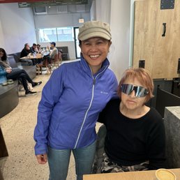 Tropicake owner with her biggest fan