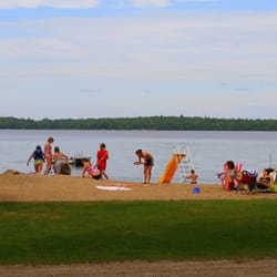 Lake Emily Resort & Campground - Enjoying the beach at Lake Emily Resort
