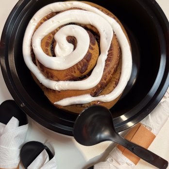 The Peach Cobbler Factory - Cinnamon Roll (Spoon to show size) - Desserts Near Me - Bloomington, Indiana The Peach Cobbler Factory - Cinnamon Roll (Spoon to show size) - Desserts Near Me - Bloomington, Indiana