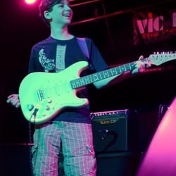 Music Teachers Network LLC - One of our guitar students on stage at ROCK SHOW