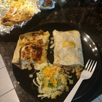 Taqueria La Esperanza - Quesadilla on the left and carnitas burrito on the right...both are only half... and check the cheese spilled ng out the quesadilla!!! - Street Vendors Near Me - Austin, Texas