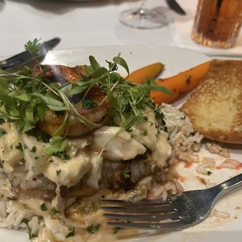 The Rouxpour - Katy - Blackened sea bass topped with lump crab, shrimp, with chimichurri rice and honey glazed carrots. Cooked to perfection! - Cajun/Creole Near Me - Katy, Texas The Rouxpour - Katy - Blackened sea bass topped with lump crab, shrimp, with chimichurri rice and honey glazed carrots. Cooked to perfection! - Cajun/Creole Near Me - Katy, Texas