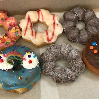 Friendly Donuts - Strawberry Pebbles mochi donut, Raspberry Lemonade mochi donut, Taro mochi donuts, M&Ms donut, and Taste the Rainbow donut - Donuts Near Me - Orange, California