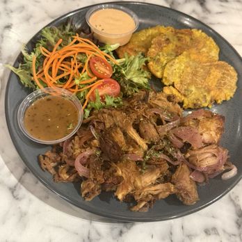 Grillers Puerto Rico - Pernil with salad and tostones - Latin American Near Me - Orlando, Florida Grillers Puerto Rico - Pernil with salad and tostones - Latin American Near Me - Orlando, Florida