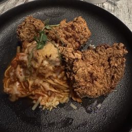 Spaghetti bolognese, includes two pieces of fried chicken