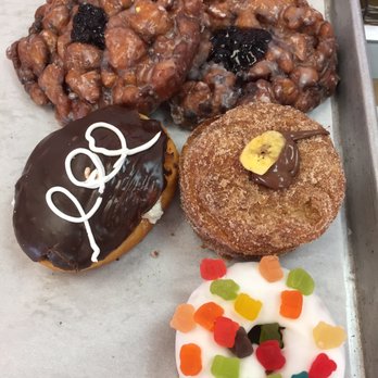 Kh Donut Fantasy - Blueberry Fritters, Banana & Nutella Crodough, Gummy in our Tummy, & Hostess Cupcake (clockwise from top left) - Donuts Near Me - Fresno, California Kh Donut Fantasy - Blueberry Fritters, Banana & Nutella Crodough, Gummy in our Tummy, & Hostess Cupcake (clockwise from top left) - Donuts Near Me - Fresno, California