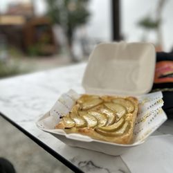 Yellow Jersey - Apple & apricot tart in the Secret Garden patio