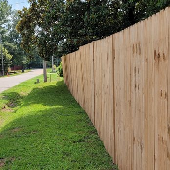 Commendable Light Construction - a wooden fence along the side of a road - General Contractors Near Me Commendable Light Construction - a wooden fence along the side of a road - General Contractors Near Me