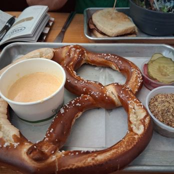 The Brewer's Cabinet - Large soft pretzel with cheese sauce, stoneground mustard and pickled onions/pickles - Brewpubs Near Me - Reno, Nevada The Brewer's Cabinet - Large soft pretzel with cheese sauce, stoneground mustard and pickled onions/pickles - Brewpubs Near Me - Reno, Nevada