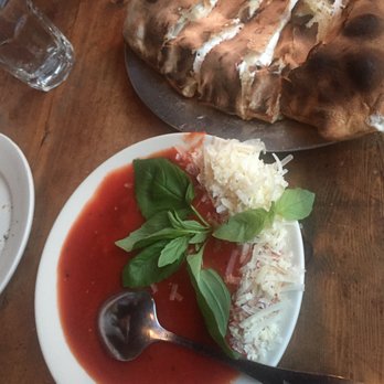 Lucali - Small Calzone (5 slices) with sauce on the side - Pizza Near Me - Brooklyn, New York