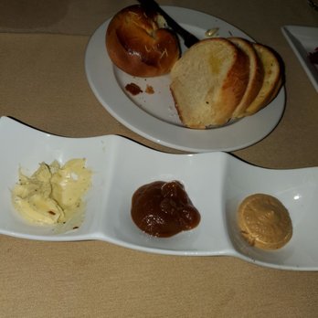 Savor - The bread plate with sea salt cracked pepper  butter along with spiced Apple pumpkin butter and last Babaganoush. - New American Near Me - Niagara Falls, New York