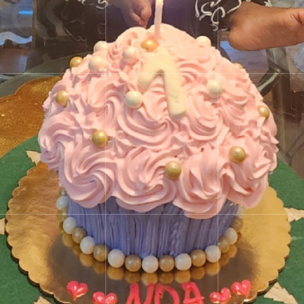 a cupcake with a lit candle a cupcake with a lit candle