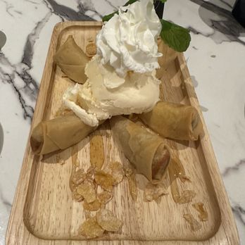 Niyom Thai Kitchen - Fried banana with ice cream, with the choice of vanilla vs. green tea ice cream. - Thai Near Me - Flushing, New York