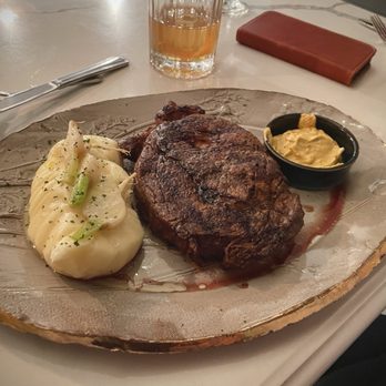 The Graceful Ordinary - cooked on a wood-burning fire 16oz Ribeye, whipped potatoes topped with Tokyo turnips and red chimichurri - New American Near Me - St. Charles, Illinois