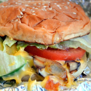 Five Guys - a hamburger with lettuce, tomato, and cheese - Burgers Near Me - Williamsburg, Virginia Five Guys - a hamburger with lettuce, tomato, and cheese - Burgers Near Me - Williamsburg, Virginia