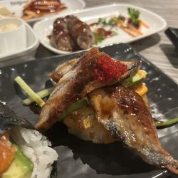 Unagi pizza (centre of photo)