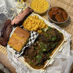 Angelas Taste Of Soul - Oxtail served over rice & gravy along with sides