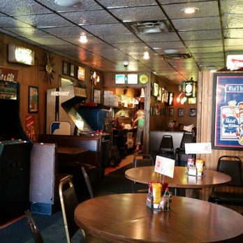 High Life Lounge - Sitting in a corner booth. View of some old school arcade games and the kitchen. - Dive Bars Near Me - Des Moines, Iowa High Life Lounge - Sitting in a corner booth. View of some old school arcade games and the kitchen. - Dive Bars Near Me - Des Moines, Iowa