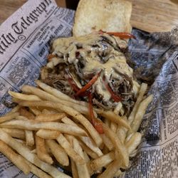 Archie & Arthur's Icehouse - Philly sandwich- smothered in gooey cheese! I wish they had a better bread option to contain all this meat! But it was still pretty good!
