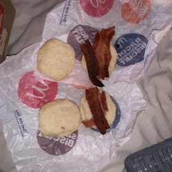 McDonald's - My "2 bacon cheese biscuits with extra bacon" I ordered and this is what i received.