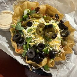 Chicken taco salad with tortilla bowl. Chicken taco salad with tortilla bowl.