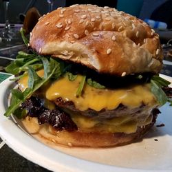 Slangers - Burger week; bacon rosemary jam, sharp cheddar, arugula, quarter pound patty on their homaid buns!