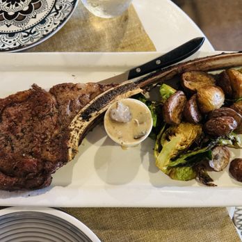 Ciccia Osteria - Tomahawk ribeye with mushroom sauce, served with potatoes & Brussels sprouts - Italian Near Me - San Diego, California