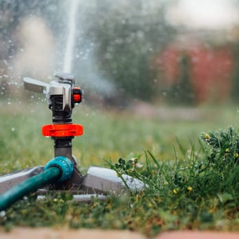 The Gardner's - a sprinkler in the grass - Landscaping Near Me - Lacey, Washington The Gardner's - a sprinkler in the grass - Landscaping Near Me - Lacey, Washington