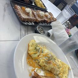 Build your own omelette, peach cobbler French toast lamb chops, eggs and grits Build your own omelette, peach cobbler French toast lamb chops, eggs and grits