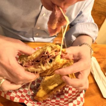 What's Cookin' Downtown - Messy thick pastrami Reuben sandwich - American Near Me - Aiken, South Carolina What's Cookin' Downtown - Messy thick pastrami Reuben sandwich - American Near Me - Aiken, South Carolina