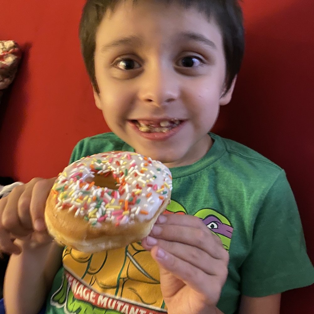 The Donut Shop - My Son Loving his vanilla w/sprinkles - Bakeries Near Me - Buckhannon, West Virginia The Donut Shop - My Son Loving his vanilla w/sprinkles - Bakeries Near Me - Buckhannon, West Virginia