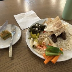 Lamb & Beef platter with hummus and grape leaves. Baklava for dessert