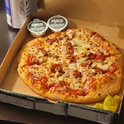 Papa Johns Pizza - sausage and pepperoni xtra garlic dipping sauce Deliver to the room was not very hot kind of warm only quality wasn't excellent either.