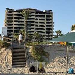 Bella Sirena - View from the beach towards hotel. Beach is full of drink vendors and water sports but I recommend taking canopy , chairs and coolers .