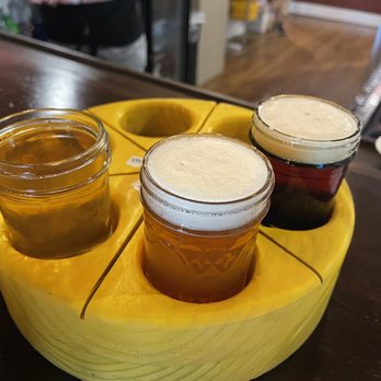 CheezHead Brewing - three jars of beer on a tray - Breweries Near Me - Beloit, Wisconsin