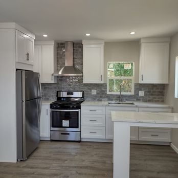 O.R. Renovations - a kitchen with stainless steel appliances - General Contractors Near Me O.R. Renovations - a kitchen with stainless steel appliances - General Contractors Near Me