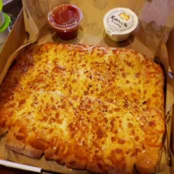 Marco's Pizza - Chezzy Bread, comes with side of pizza sauce and range dressing. - Pizza Near Me - Tampa, Florida Marco's Pizza - Chezzy Bread, comes with side of pizza sauce and range dressing. - Pizza Near Me - Tampa, Florida